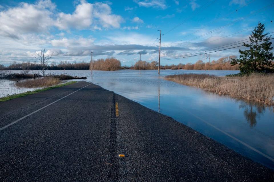 Flooding closes a section of Smith Road on Monday, Nov. 29, in Whatcom County. More rain is falling in the region Tuesday morning and a new flood watch has been issued for the Nooksack River through Thursday, Dec. 2.