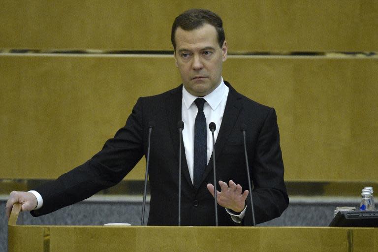 Russian Prime Minister Dmitry Medvedev takes a hard line on Ukraine's debt repayments