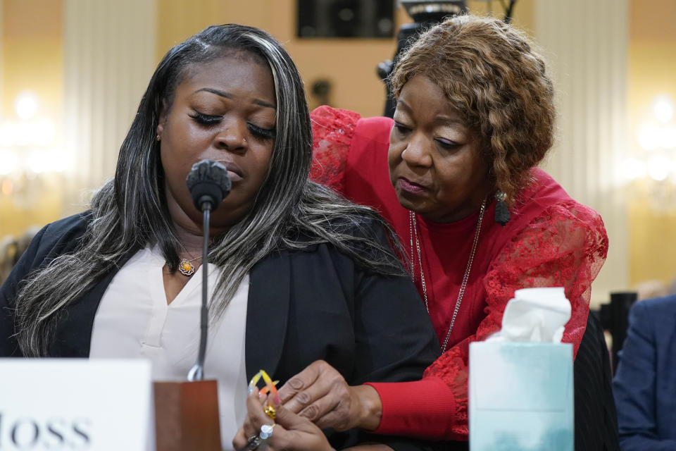 FILE - Wandrea "Shaye" Moss, a former Georgia election worker, is comforted by her mother, Ruby Freeman, right, as the House select committee investigating the Jan. 6 attack on the U.S. Capitol holds a hearing at the Capitol in Washington, June 21, 2022. The mother and daughter who were election workers in Georgia brought the sense of danger into stark relief. They testified they feared even to say their names in public after Trump wrongly accused them of voter fraud. The Jan. 6 congressional hearings have paused, at least for now, and Washington is taking stock of what was learned about the actions of Donald Trump and associates surrounding the Capitol attack. (AP Photo/Jacquelyn Martin, File)