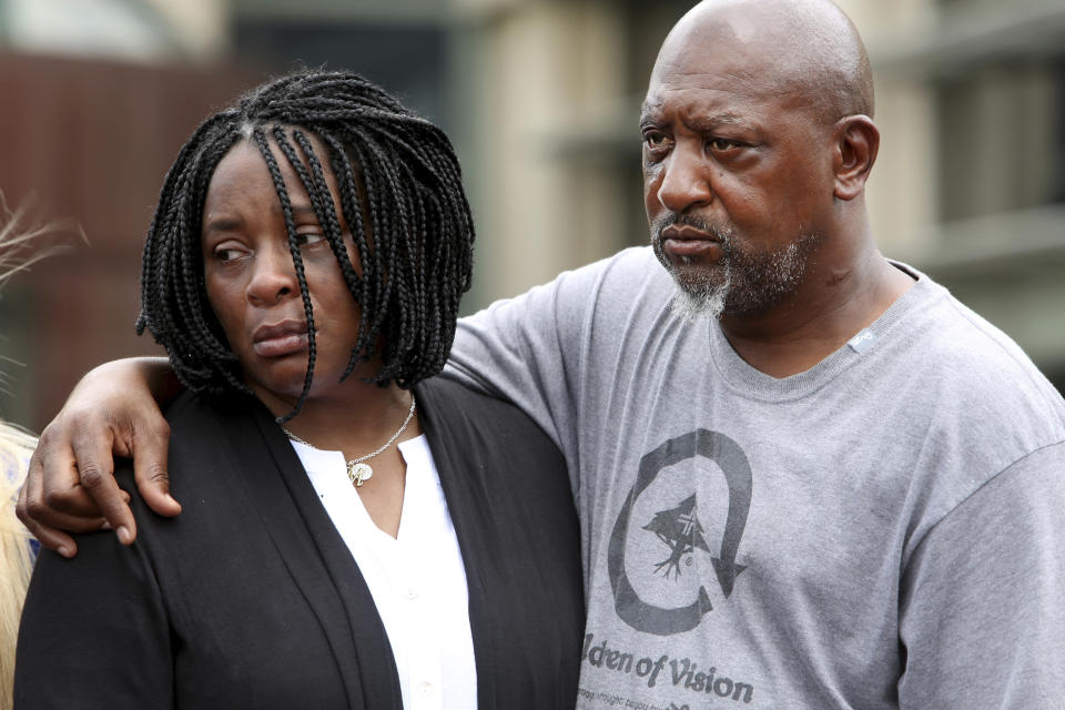 Monica Moore, mother of Markeis McGlockton, left, is comforted by Louis Robinson while attending a press conference at the Pinellas County Criminal Justice Center Thursday, July 26, 2018, in Clearwater, Fla. McGlockton, an unarmed black man was fatally shot outside a Clearwater convenience store on July 19. (Douglas R. Clifford/Tampa Bay Times via AP)