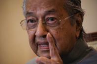 Malaysia's former Prime Minister Mahathir Mohamad speaks during a news conference in Putrajaya