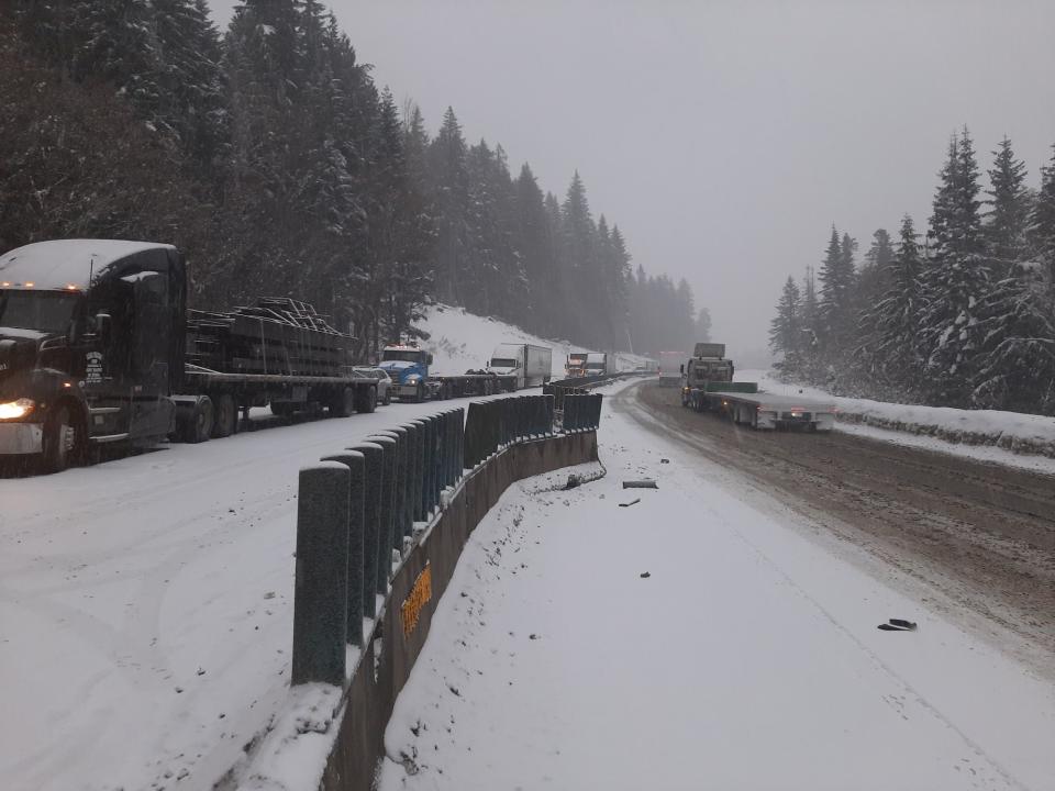 Both directions of Interstate 90 are closed after semis crashed, damaging sections of concrete barrier and pushing it from the westbound lanes into the eastbound lanes.