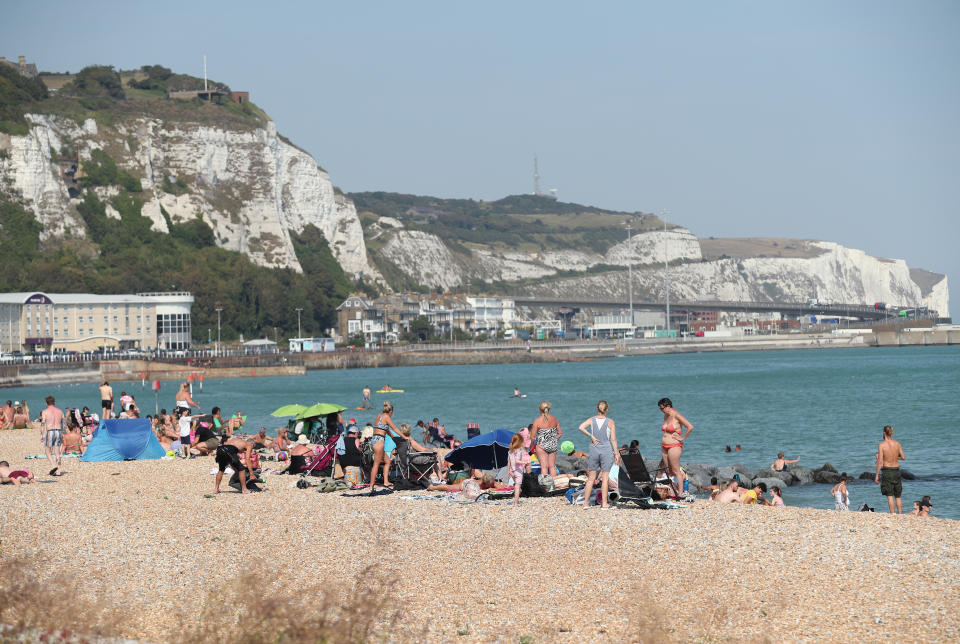 People enjoying the warm weather on a beach in Dover, Kent.