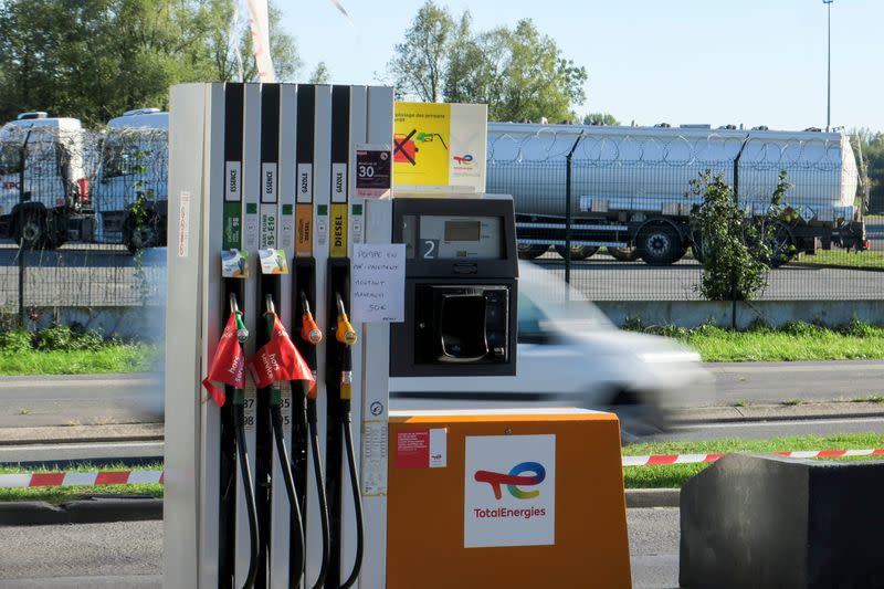 Signs which read "out of order" are seen on gasoline pumps at a TotalEnergies gas station just in front of a petrol storage facility in Haulchin