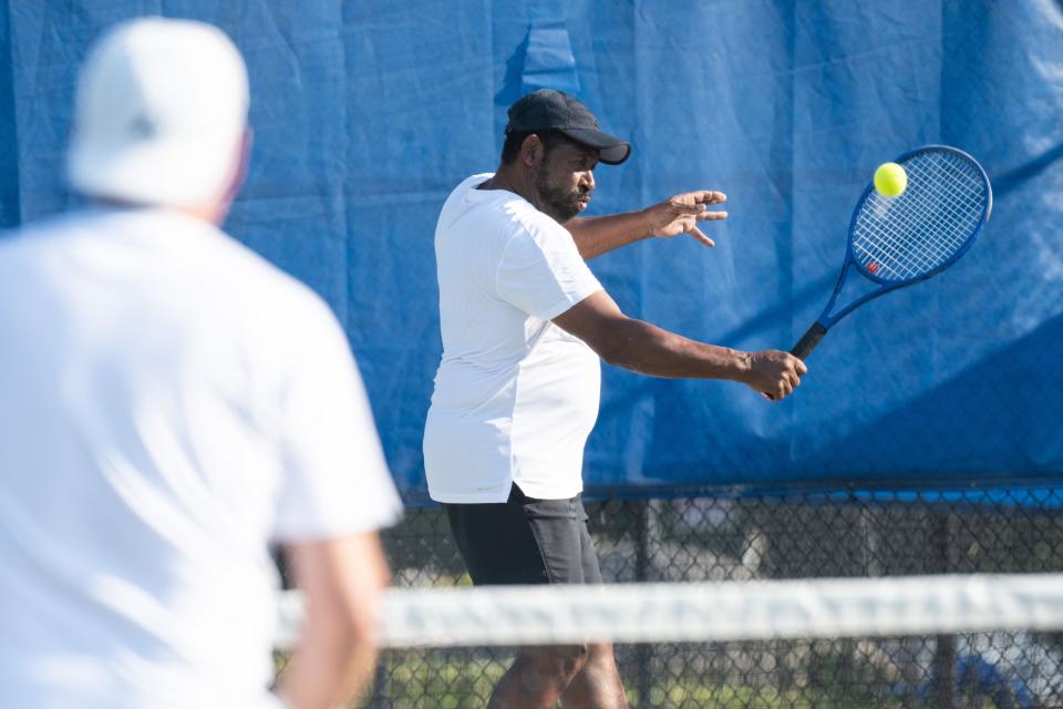 Tennis players compete at the 2021 Asheville Open.