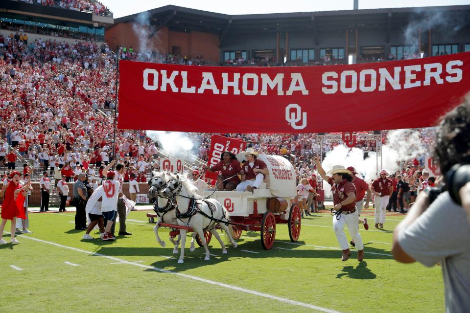 The Sooner Schooner takes the field wih the Oklahoma team before a college football game between the University of Oklahoma Sooners (OU) and the Arkansas State Red Wolves at Gaylord Family-Oklahoma Memorial Stadium in Norman, Okla., Saturday, Sept. 2, 2023. Oklahoma won 73-0.