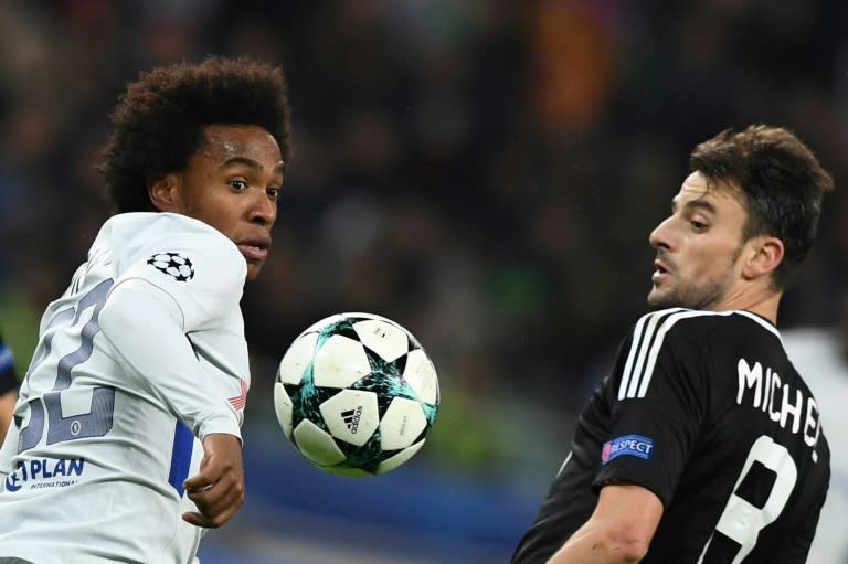 Chelsea's midfielder Willian (L) and Qarabag's midfielder Michel vie for the ball during the UEFA Champions League Group C football match November 22, 2017