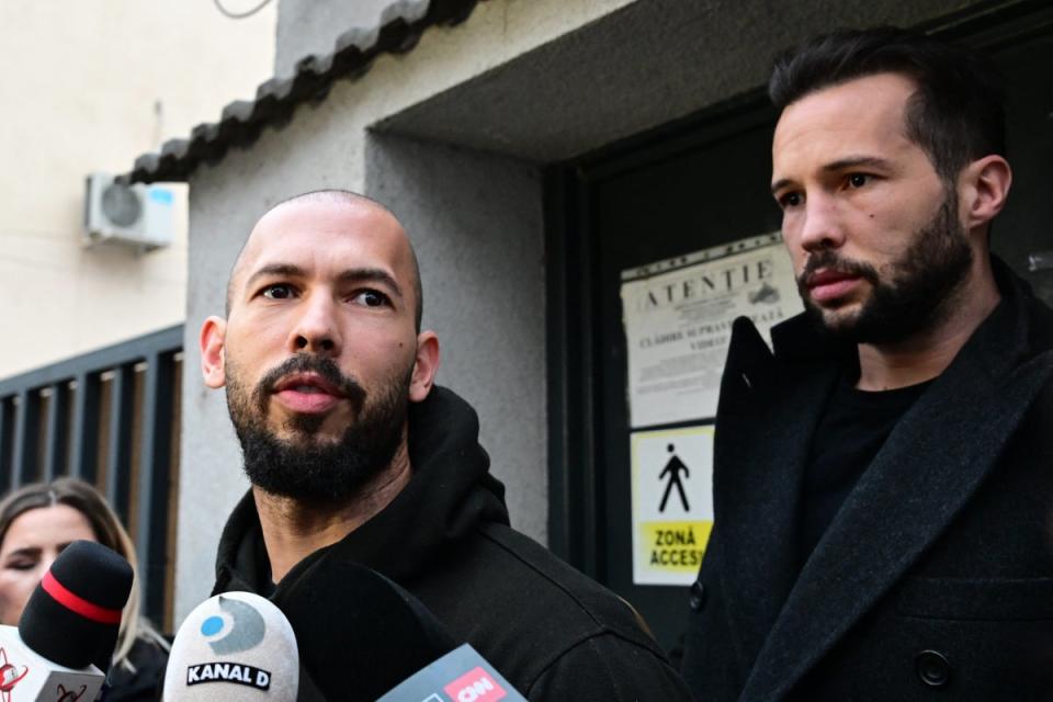 Andrew Tate and his brother leaving Bucharest Court of Appeal (AFP via Getty Images)