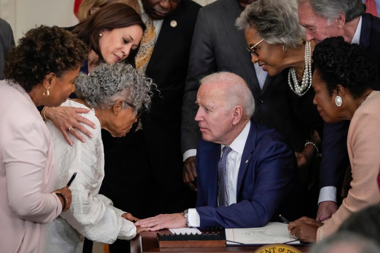 Ninety-four-year-old activist and retired educator Opal Lee, known as the Grandmother of Juneteenth, speaks with US president Joe Biden after he signed the Juneteenth National Independence Day Act into law in the East Room of the White House on 17 June 2021 in Washington, DC (Getty Images)