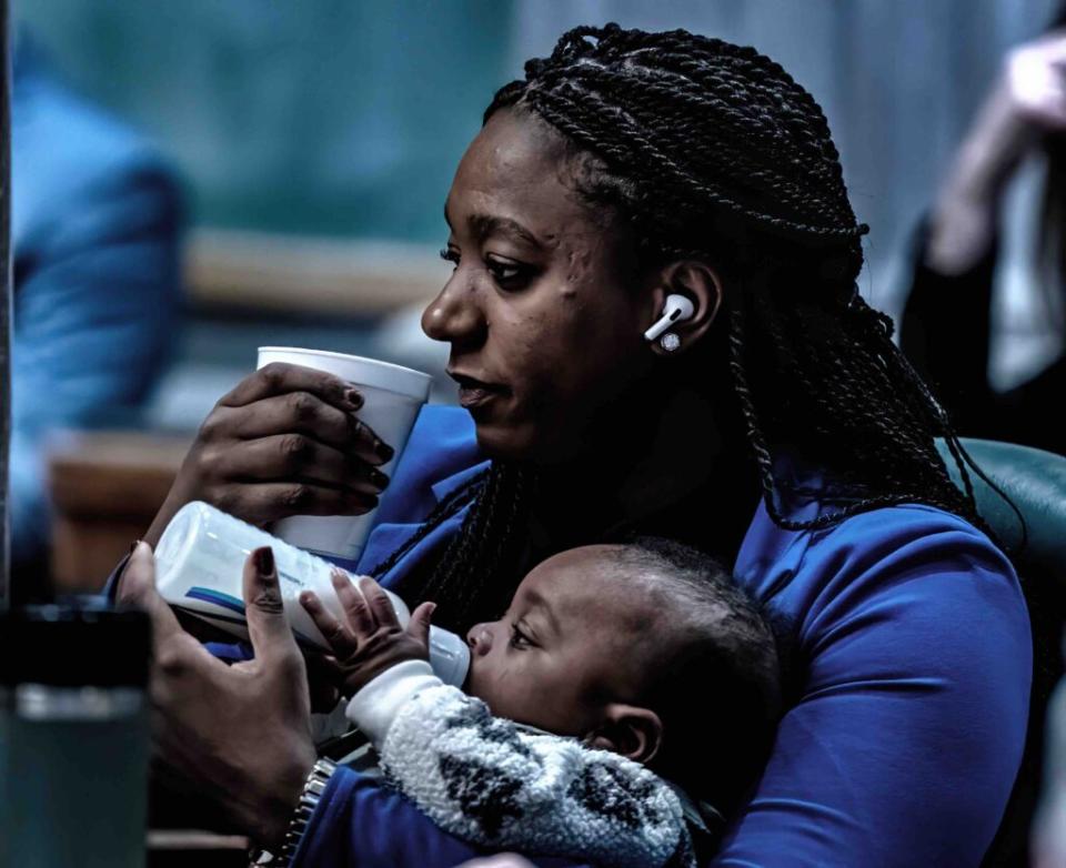 Rep. London Lamar, a Memphis Democrat, gives her infant son a bottle during a Tennessee Senate Session in January 2024. (Photo: John Partipilo)