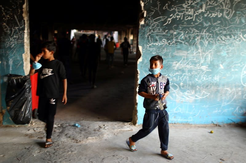 Iraqi children are seen inside the high-rise building, called by Iraqi the Turkish Restaurant Building, during anti-government protests in Baghdad