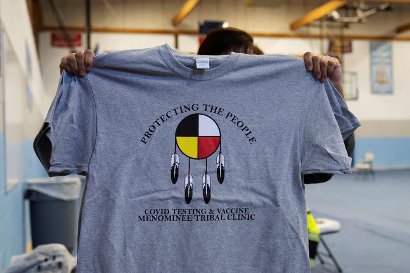 People from rural communities get their coronavirus disease (COVID-19) vaccinations at Menominee Indian High School in Menominee, Wisconsin