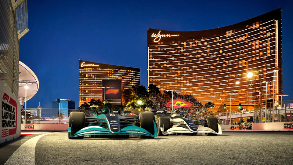 The Wynn Las Vegas with two Formula 1 race cars in foreground.