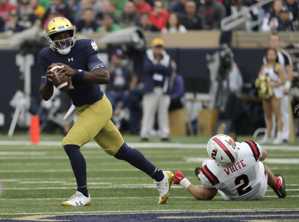 File- This Sept. 8, 2018, file photo shows Notre Dame quarterback Brandon Wimbush looking to pass against Ball State during the first half of an NCAA college football game in South Bend, Ind. Wimbush is practicing with Notre Dame to be the No. 2 quarterback for the third-ranked Fighting Irish in the Cotton Bowl amid questions about his future with the team after the College Football Playoff. There have been several media reports indicating that Wimbush has notified Notre Dame that he intends to transfer. (AP Photo/Nam Y. Huh, File)