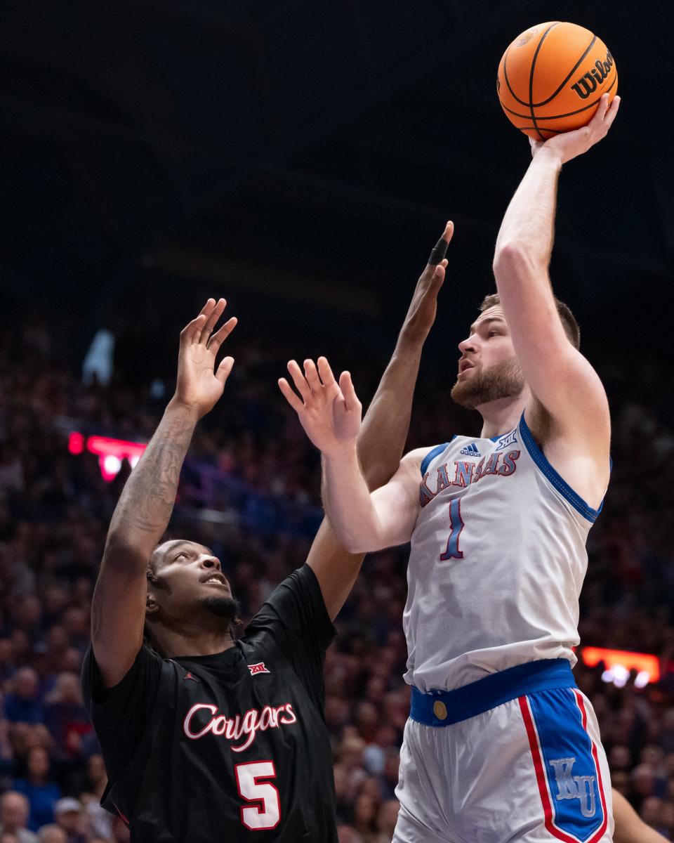 Kansas basketball center Hunter Dickinson (1) gets a shot up during a game on Feb. 3, 2024 in Allen Fieldhouse.