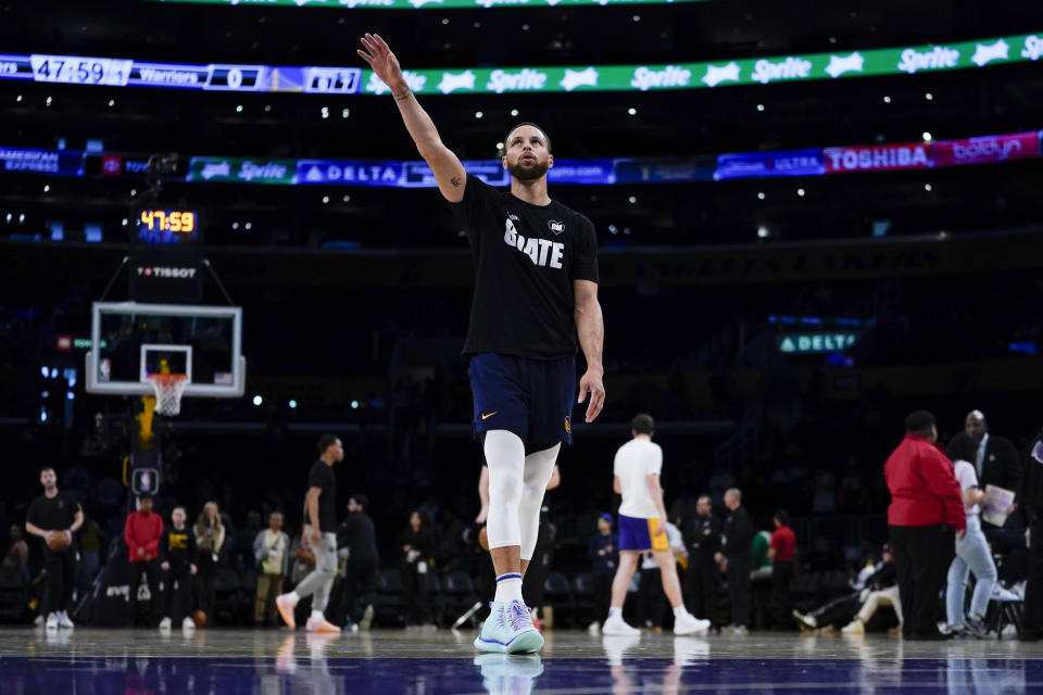 Golden State Warriors guard Stephen Curry warms up for the team's NBA basketball game against the Los Angeles Lakers, Tuesday, April 9, 2024, in Los Angeles. (AP Photo/Ryan Sun)