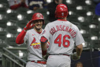 St. Louis Cardinals' Paul Goldschmidt (46) is congratulated by Nolan Arenado after hitting a two-run home run during the 11th inning of the team's baseball game against the Milwaukee Brewers on Tuesday, May 11, 2021, in Milwaukee. (AP Photo/Aaron Gash)