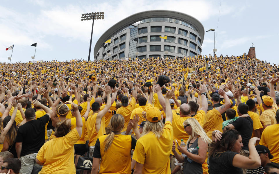 Iowa fans wave to children in the University of Iowa Stead Family Children’s Hospital in September 2017. (AP)