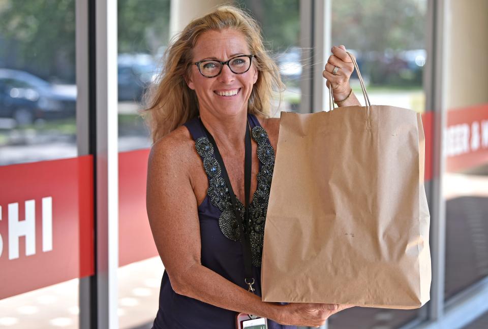 Betsy Bray has been a gig worker for five years. These days she mainly does Instacart but also picks up for DoorDash, UberEats and GrubHub in and around northwest Bradenton. Here Bray, picks up a lunch delivery from Kiku Sushi & Grill located in Bradenton.