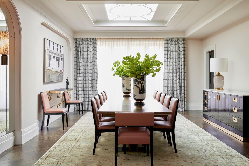 The inspiration for the dining room was the Art Deco dining room at Eltham Palace in southeast London. The table was custom-made by Irish company Klimmek Furniture and is surrounded by dining chairs by Ecart. The console is from Soane Britain while the 1970s vases are from AD Antiques Paris.