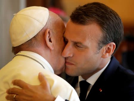 Pope Francis greeets French President Emmanuel Macron during a private audience at the Vatican, June 26, 2018. Alessandra Tarantino/Pool via Reuters