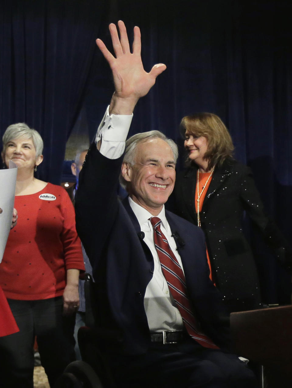 FILE - In this March 4, 2014, file photo, Texas Attorney General Greg Abbott waves to supporters as he arrives for his victory party in San Antonio. Abbott won the Republican nomination for Texas governor. On Wednesday, March 5, 2014, the state of Texas emerged from the nation's first primary of 2014 looking solidly Republican as ever. Now the Texas governor's race really begins _ and Democrat gubernatorial candidate Wendy Davis insists that, yes, it'll be a race. (AP Photo/Eric Gay, File)