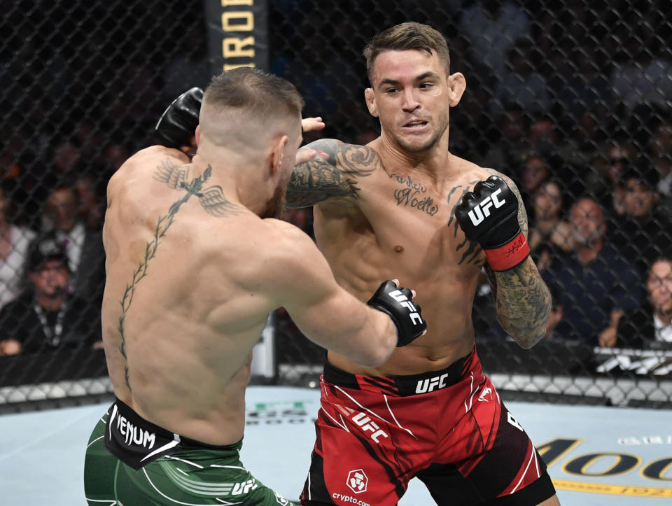 Dustin Poirier (pictured right) punches Conor McGregor (pictutred left) in their welterweight fight during the UFC 264 event at T-Mobile Arena on July 10, 2021 in Las Vegas, Nevada.