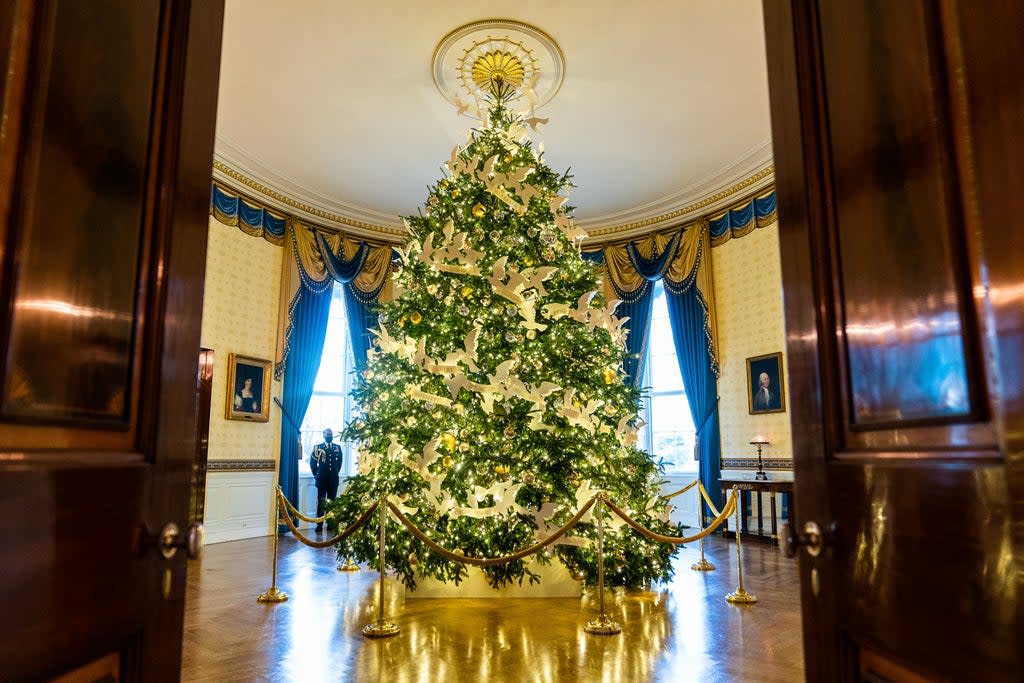 The White House Christmas tree is dotted with peace doves holding white ribbons bearing the name of each state (Washington Post)