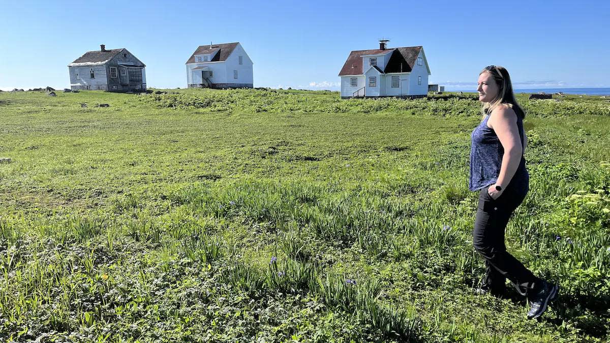 Jenny Thomas, treasurer of the Corporation de l’Île Greenly, walks on Greenly Island in eastern Quebec. Her grandfather was the island's last lighthouse keeper. (Lambert Gagné-Coulombe/Radio-Canada - image credit)