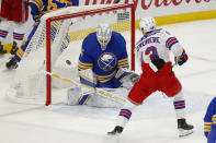 Buffalo Sabres goalie Linus Ullmark (35) stops New York Rangers forward Alexis Lafreniere (13) during the third period of an NHL hockey game, Tuesday, Jan. 26, 2021, in Buffalo, N.Y. (AP Photo/Jeffrey T. Barnes)