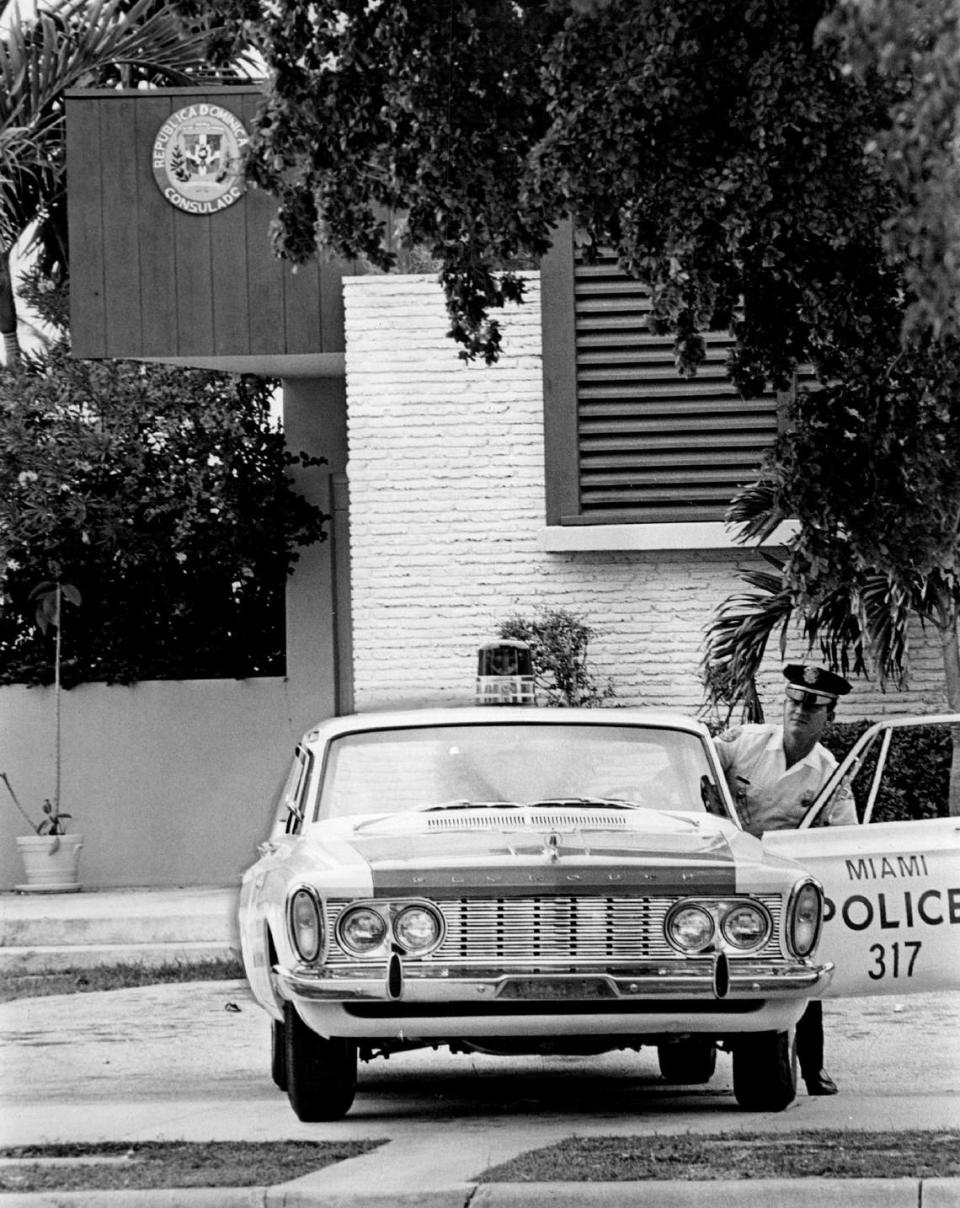 In 1965, a Miami police car in position at the Dominican Consulate on Brickell Avenue in Miami.