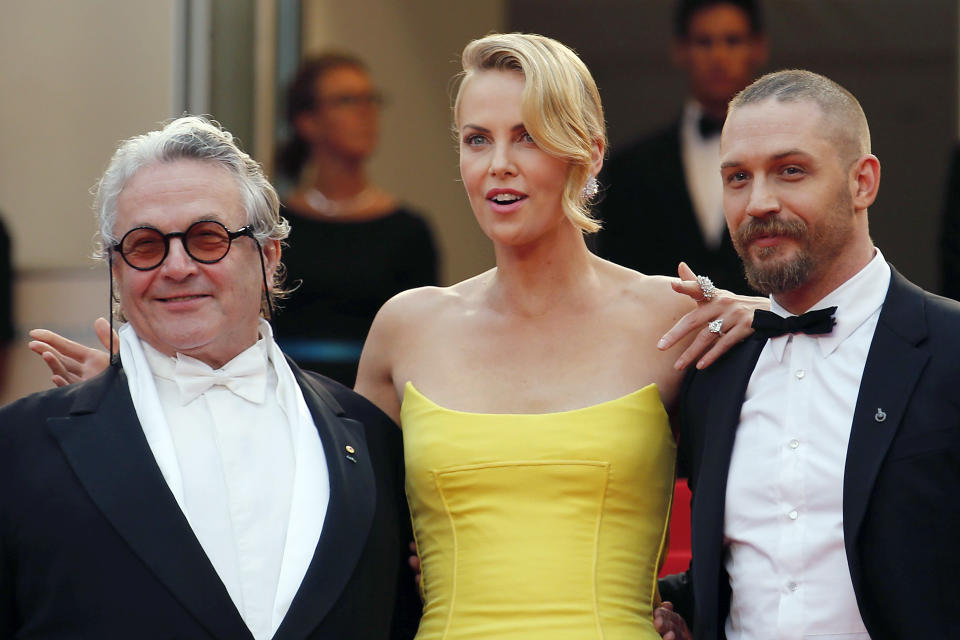 (L-R) Director George Miller, cast members Charlize Theron and Tom Hardy pose on the red carpet as they arrive for the screening of the film "Mad Max: Fury Road" out of competition at the 68th Cannes Film Festival in Cannes, southern France, May 14, 2015.        REUTERS/Regis Duvignau 