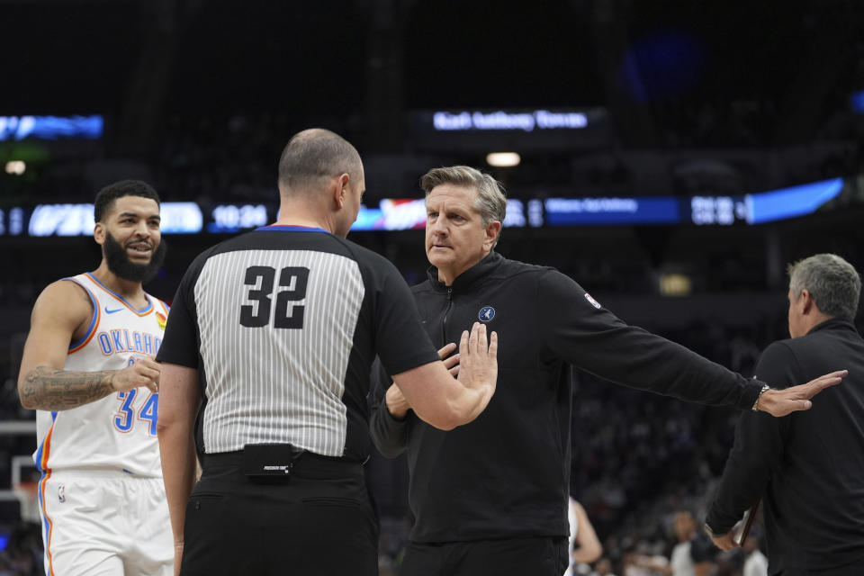 Minnesota Timberwolves head coach Chris Finch, right, talks with referee Marat Kogut during the first half of an NBA basketball game against the Oklahoma City Thunder, Saturday, Jan. 20, 2024, in Minneapolis. (AP Photo/Abbie Parr)