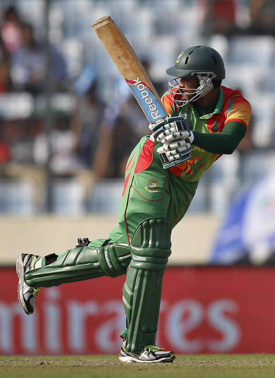 Bangladesh batsman Shakib Al Hasan watches his shot during their ICC Twenty20 Cricket World Cup match against Australia, in Dhaka, Bangladesh, Tuesday, April 1, 2014. (AP Photo/Aijaz Rahi)