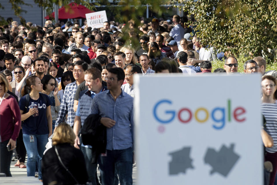 FILE - In this Nov. 1, 2018, file photo, workers leave Google's Mountain View, Calif., main quad after some Google employees walked off the job in a protest against what they said is the tech company's mishandling of sexual misconduct allegations against executives. Employees at Google, Amazon, Microsoft and elsewhere are increasingly speaking out about military warfare, immigration and the environment, and questioning the effects of their work. Experts say it’s an unprecedented trend of activism in Big Tech. (AP Photo/Noah Berger, File)