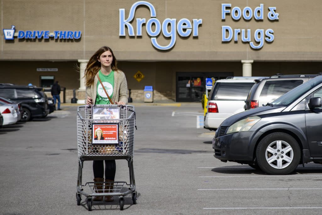 Destiny Frith, 24, of Nashville, a shopper for Shipt, walks to her car after shopping for a customer at a Kroger in Franklin, Tenn.