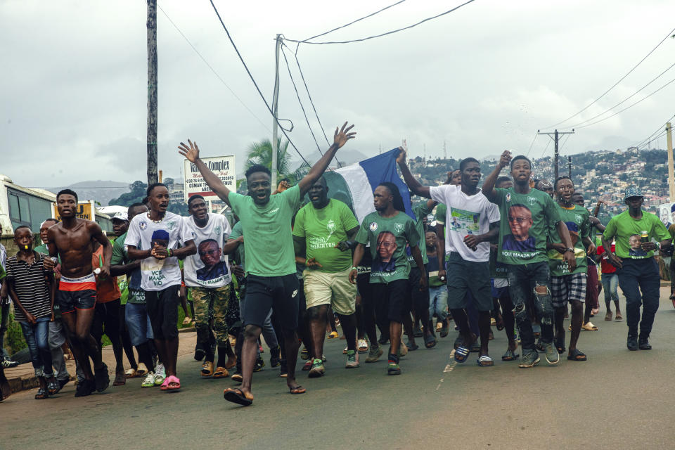 Supporters of President Julius Maada Bio celebrate in the streets of Freetown, Sierra Leone, after the electoral commission declared him the winner, Tuesday June 27, 2023. Sierra Leone's election commission says President Julius Maada Bio has won a second term in office. (AP Photo/TJ Bade)