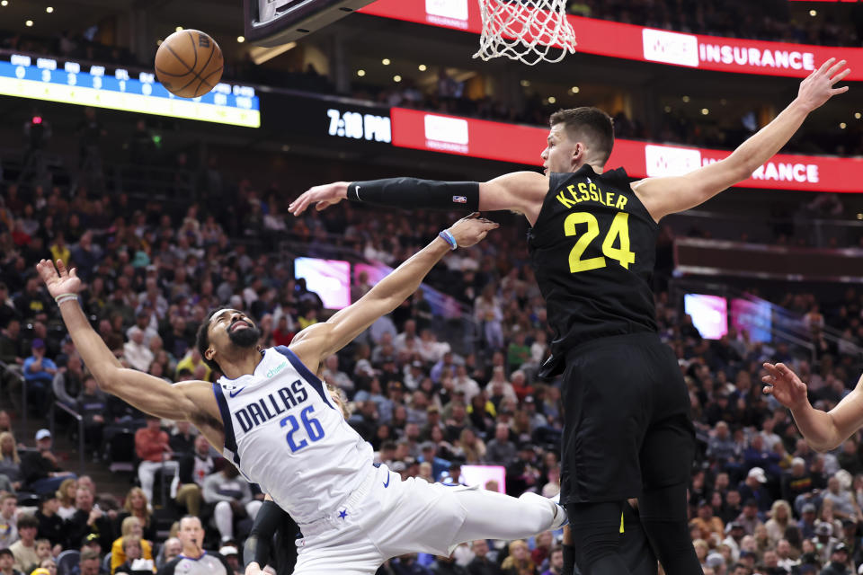 Dallas Mavericks guard Spencer Dinwiddie (26) has a shot blocked by Utah Jazz center Walker Kessler (24) in the first quarter of an NBA basketball game Saturday, Jan. 28, 2023, in Salt Lake City. (AP Photo/Rob Gray)