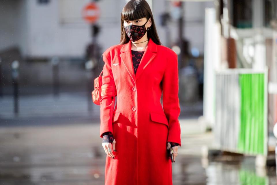 Model Kozue Akimoto heads to the Marine Serre show.