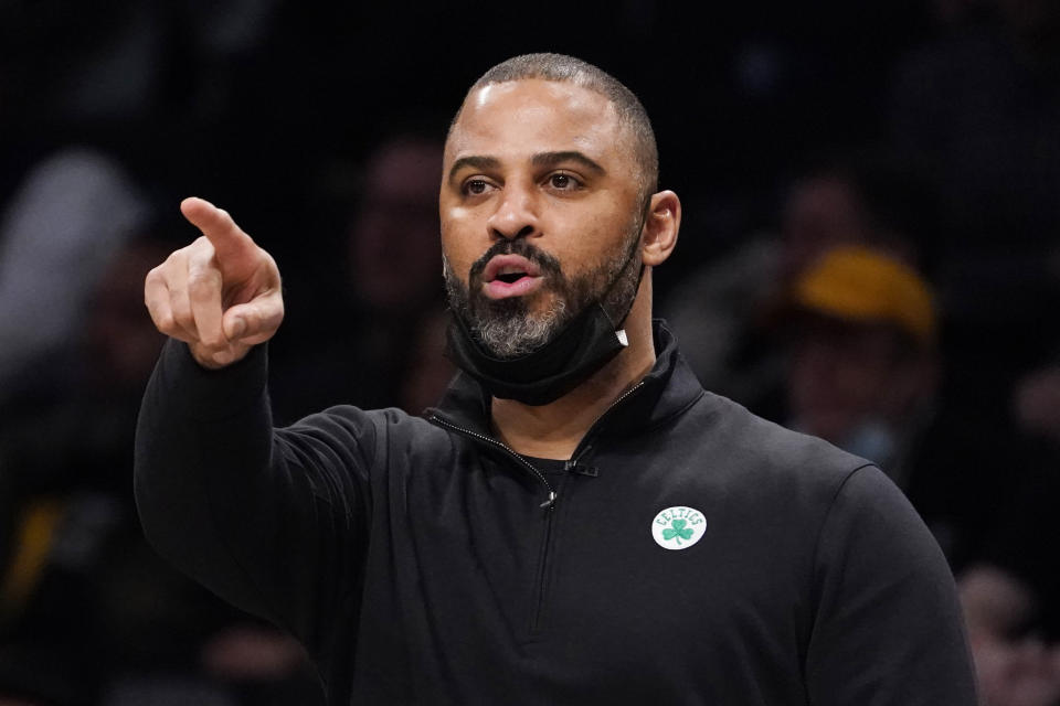 Boston Celtics head coach Ime Udoka directs his players from the bench during the first half of an NBA basketball game against the Brooklyn Nets, Tuesday, Feb. 8, 2022, in New York. (AP Photo/John Minchillo)