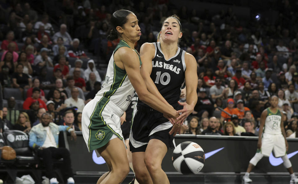 Seattle Storm guard Skylar Diggins-Smith knocks the ball away from Las Vegas Aces guard Kelsey Plum (10) during the first half of a WNBA basketball game in Las Vegas on Friday, June 7, 2024. (Steve Marcus/Las Vegas Sun via AP)