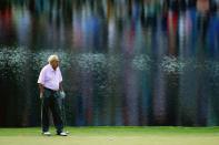 <p>Arnold Palmer waits on a green during the 2014 Par 3 Contest prior to the start of the 2014 Masters Tournament at Augusta National Golf Club on April 9, 2014 in Augusta, Georgia. (Photo by David Cannon/Getty Images) </p>