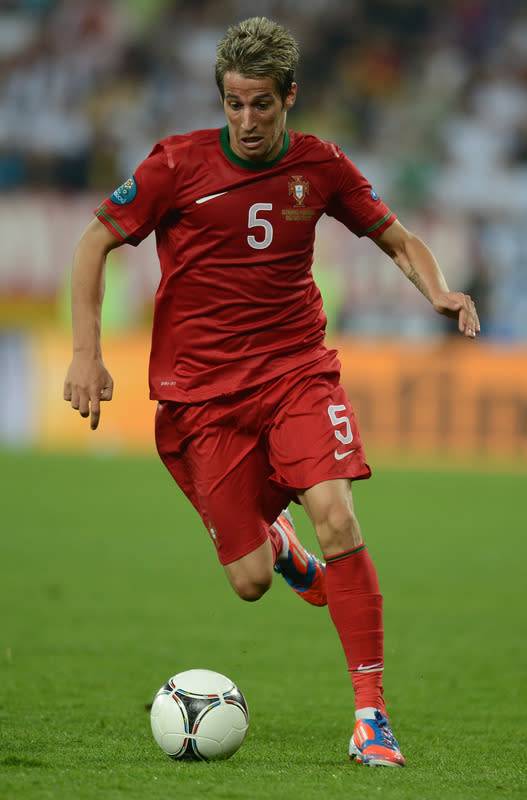 Portuguese defender Fabio Coentrao runs with the ball during the Euro 2012 championships football match Germany vs Portugal on June 9, 2012 at the Arena Lviv. AFP PHOTO / JEFF PACHOUDJEFF PACHOUD/AFP/GettyImages