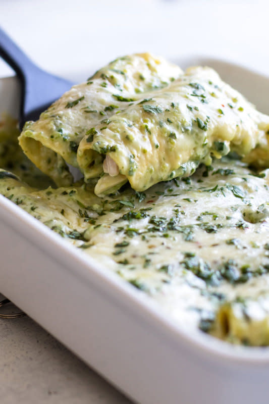 <p>Girl Gone Gourmet</p><p>The combination of the rich white sauce flavored with warm poblano peppers and fresh cilantro is so delicious.</p><p><strong>Get the recipe: <a href="https://www.girlgonegourmet.com/poblano-chicken-enchiladas/" rel="nofollow noopener" target="_blank" data-ylk="slk:Creamy Poblano Chicken Enchiladas;elm:context_link;itc:0;sec:content-canvas" class="link ">Creamy Poblano Chicken Enchiladas</a></strong></p>