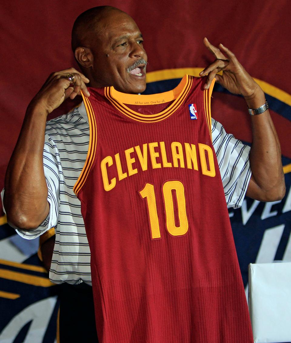 Former Cleveland Cavaliers No. 1 overall draft pick Austin Carr holds up a team uniform on Aug. 17, 2010.