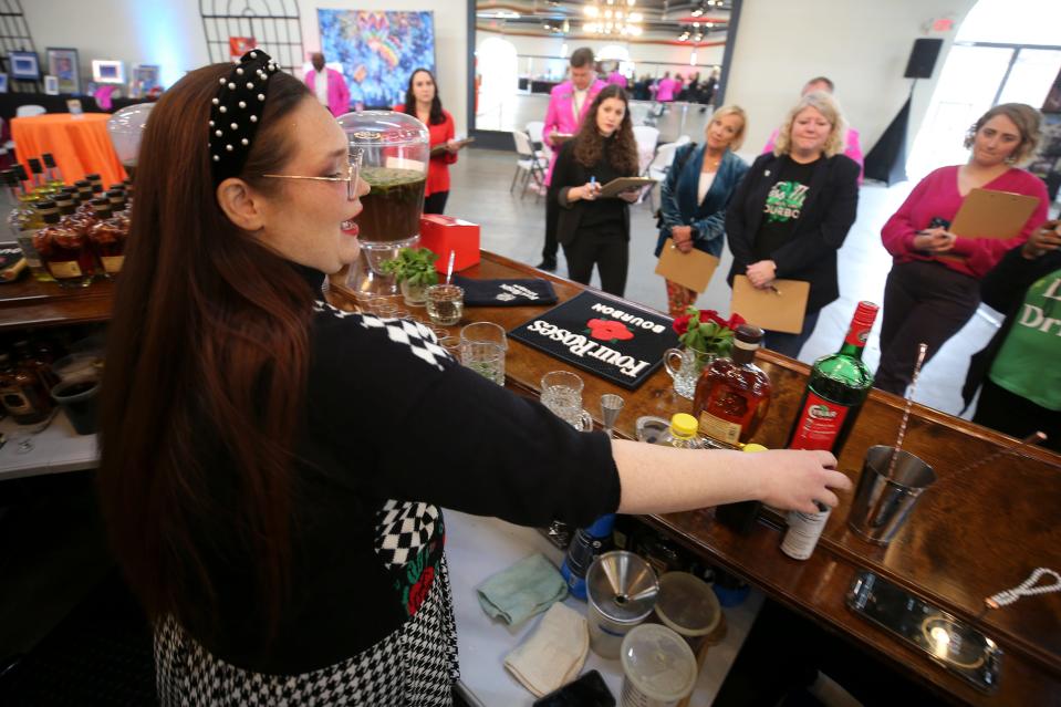 SC Baker from Bar Expo creates her mint julep called Spend a Buck at the Kentucky Derby Festival Four Roses Mint Julep Contest on Thursday, March 16, 2023, at the Mellwood Arts Center.