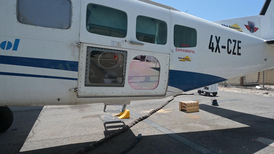 This undated handout photo, provided by the Israeli Ministry of Defense, shows a high-power Laser system installed on an aircraft at an undisclosed location. The prototype, developed with Elbit Systems, was mounted on a civilian plane and successfully shot down “several” drones in a recent test over the Mediterranean Sea, according to Brig. Gen. Yaniv Rotem, head of military research and development at the Defense Ministry on Monday, June 21, 2021. (Ministry of Defense Spokesperson’s Office via AP)