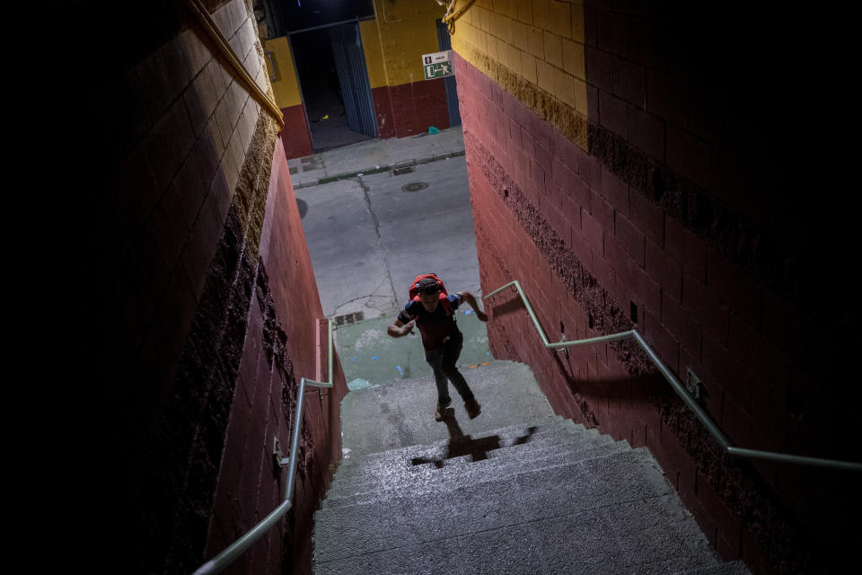 A migrant runs after crossing into the Spanish enclave of Ceuta, near the border of Morocco and Spain, early Wednesday, May 19, 2021. (AP Photo/Bernat Armangue)