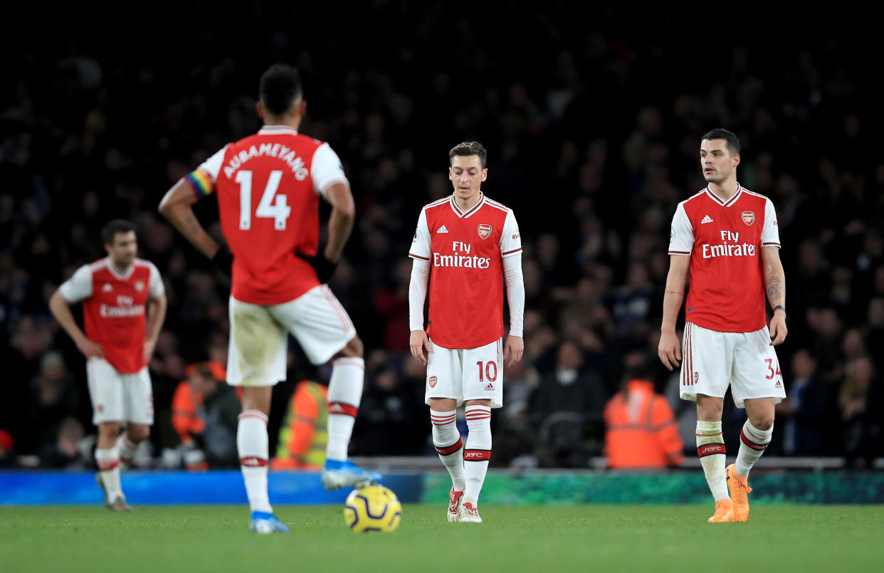 LONDON, ENGLAND - DECEMBER 05: Mesut Ozil of Arsenal and Granit Xhaka of Arsenal are looking dejected after Neal Maupay of Brighton scored during the Premier League match between Arsenal FC and Brighton & Hove Albion at Emirates Stadium on December 05, 2019 in London, United Kingdom. (Photo by Marc Atkins/Getty Images)