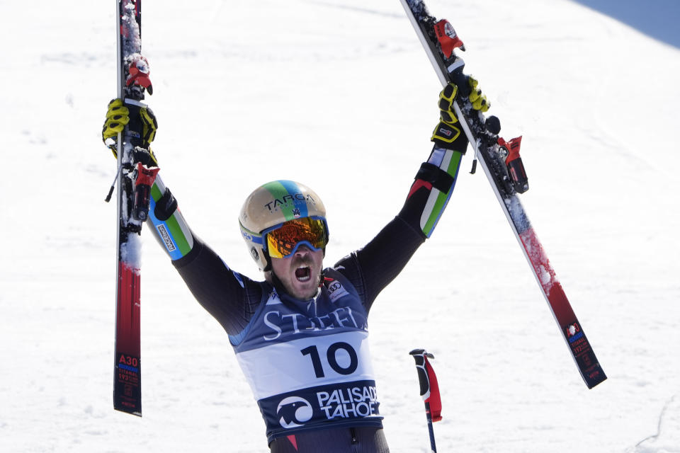 River Radamus, of the United States, celebrates his third place finish in men's World Cup giant slalom skiing race Saturday, Feb. 24, 2024, at Palisades Tahoe ski resort in Lake Tahoe, Calif. (AP Photo/Robert F. Bukaty)